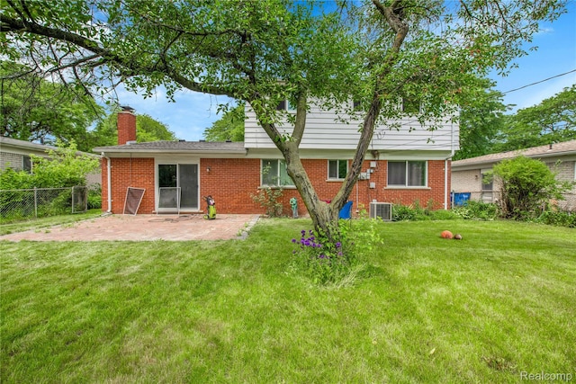 27416 Audrey Ave, Macomb, MI 48092 - back of property featuring a patio area, brick siding, and a chimney