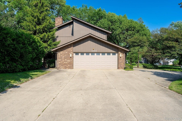 5156 Chestershire Ct, West Bloomfield, MI 48322 - view of front of house with brick siding, a chimney, and driveway