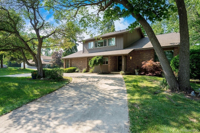 5156 Chestershire Ct, West Bloomfield, MI 48322 - view of front of property featuring concrete driveway, a front lawn, and brick siding