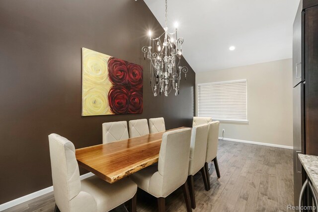 5156 Chestershire Ct, West Bloomfield, MI 48322 - dining room with a chandelier, wood finished floors, vaulted ceiling, and recessed lighting