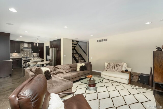 5156 Chestershire Ct, West Bloomfield, MI 48322 - living room featuring stairway, wood finished floors, and recessed lighting