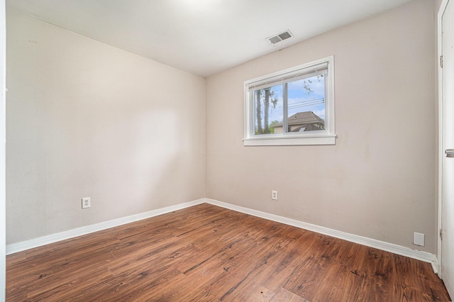 81 Chopin Ave, Troy, MI 48083 - spare room with baseboards and wood finished floors