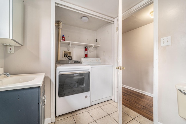 81 Chopin Ave, Troy, MI 48083 - laundry area featuring light tile patterned floors and washer and dryer