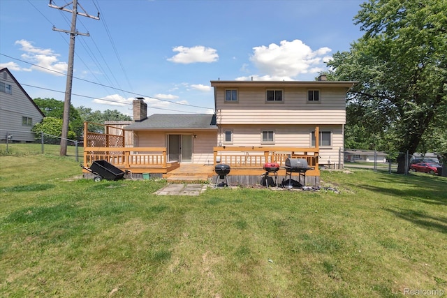 1337 Heathercrest Dr, Flint, MI 48532 - back of property with a wooden deck and a chimney