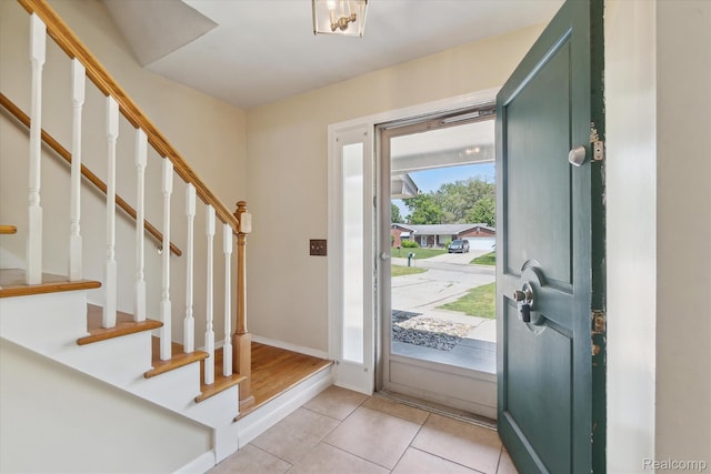 1337 Heathercrest Dr, Flint, MI 48532 - foyer featuring stairs and light tile patterned floors