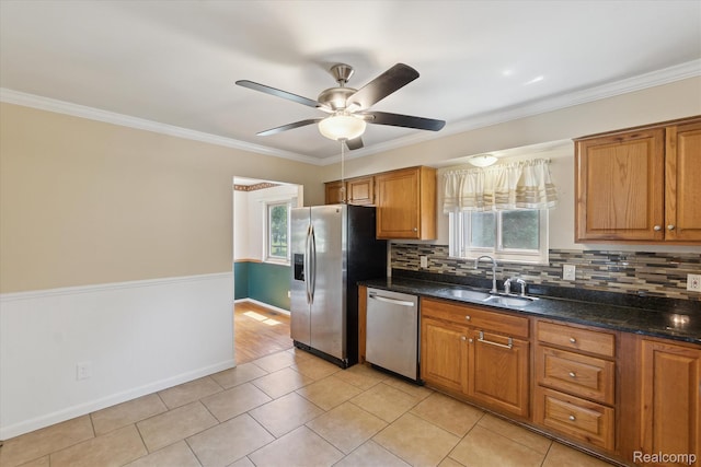 1337 Heathercrest Dr, Flint, MI 48532 - kitchen with stainless steel appliances, healthy amount of natural light, backsplash, ceiling fan, and ornamental molding