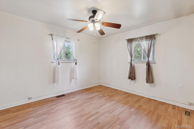 1337 Heathercrest Dr, Flint, MI 48532 - empty room with light wood finished floors and a ceiling fan