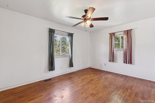1337 Heathercrest Dr, Flint, MI 48532 - spare room featuring wood finished floors, plenty of natural light, and ceiling fan
