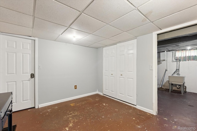 1337 Heathercrest Dr, Flint, MI 48532 - finished below grade area featuring baseboards and a drop ceiling