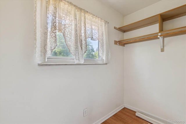 1337 Heathercrest Dr, Flint, MI 48532 - spacious closet featuring wood finished floors