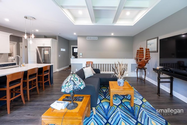 6853 Loggers Ridge Run SE, Caledonia, MI 49316 - living area featuring dark wood-style floors, recessed lighting, coffered ceiling, and beamed ceiling