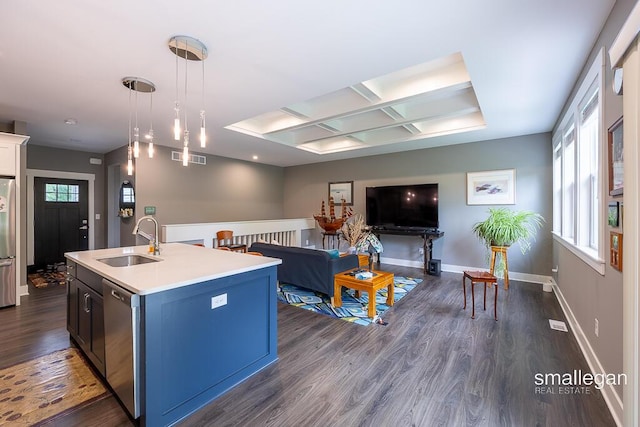 6853 Loggers Ridge Run SE, Caledonia, MI 49316 - kitchen featuring coffered ceiling, appliances with stainless steel finishes, light countertops, dark wood-style floors, and an island with sink