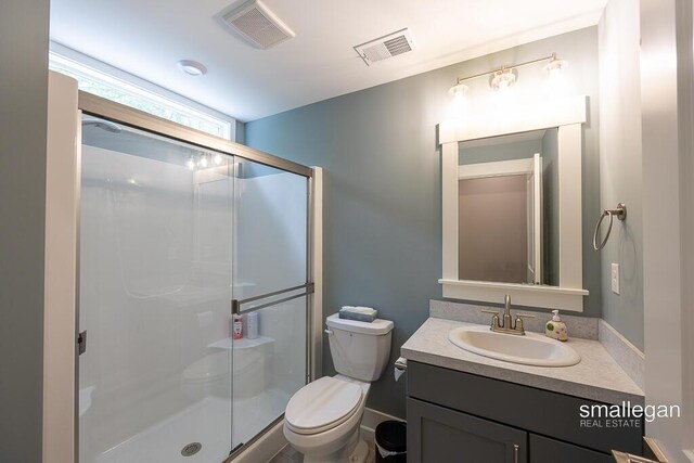 6853 Loggers Ridge Run SE, Caledonia, MI 49316 - bathroom featuring a stall shower and vanity