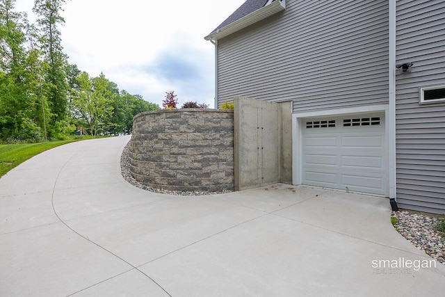 6853 Loggers Ridge Run SE, Caledonia, MI 49316 - garage with concrete driveway
