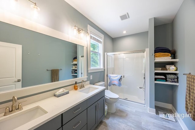 6853 Loggers Ridge Run SE, Caledonia, MI 49316 - bathroom featuring a stall shower and double vanity