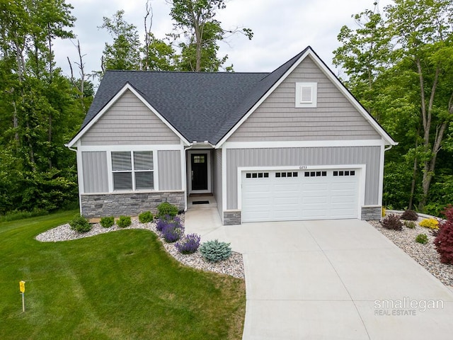 6853 Loggers Ridge Run SE, Caledonia, MI 49316 - view of front of property with stone siding, a garage, a front yard, board and batten siding, and driveway