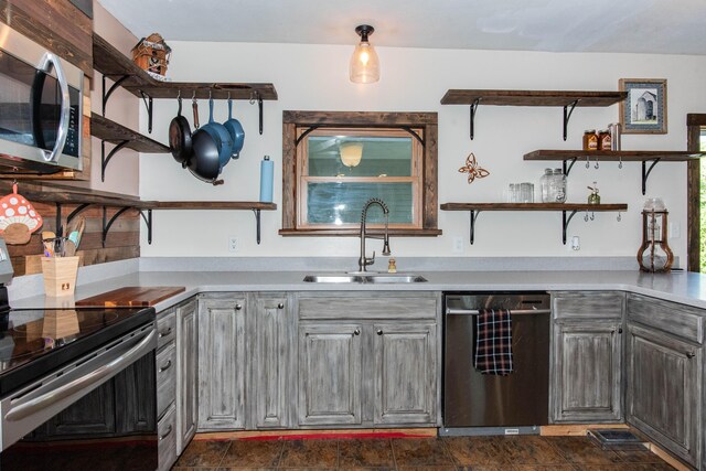 185 Race St, Constantine, MI 49042 - kitchen with stainless steel appliances, open shelves, light countertops, and gray cabinetry
