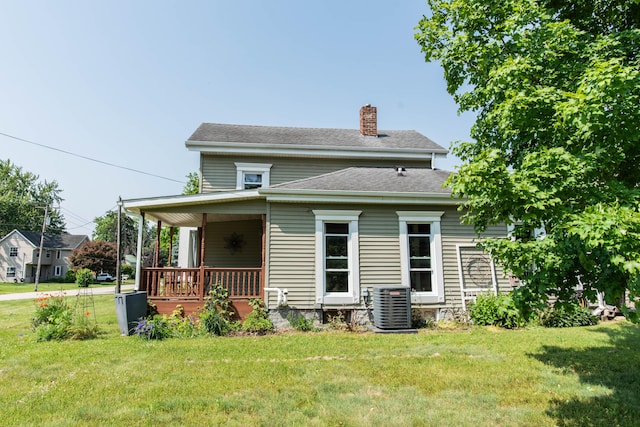 185 Race St, Constantine, MI 49042 - rear view of property featuring a chimney, a lawn, a porch, and roof with shingles