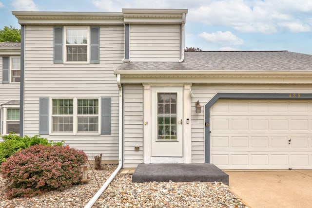429 Zehnder Dr, Frankenmuth, MI 48734 - view of front of house featuring driveway, a garage, and a shingled roof