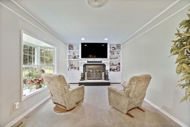 429 Zehnder Dr, Frankenmuth, MI 48734 - carpeted living room with a fireplace, ornamental molding, built in shelves, and recessed lighting