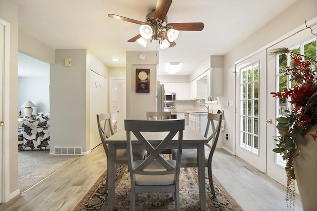 429 Zehnder Dr, Frankenmuth, MI 48734 - dining area with light wood-type flooring and a ceiling fan
