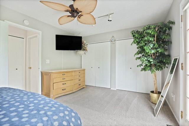 429 Zehnder Dr, Frankenmuth, MI 48734 - carpeted bedroom featuring two closets and ceiling fan