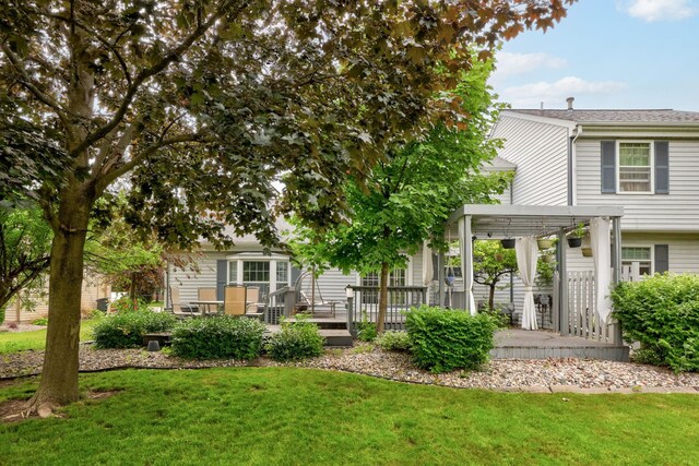 429 Zehnder Dr, Frankenmuth, MI 48734 - back of house featuring a yard and a wooden deck