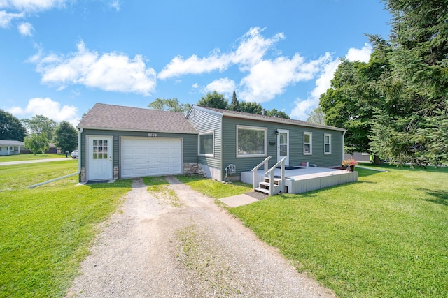 159 W Southfield Dr, Jackson, MI 49203 - view of front facade with dirt driveway, an attached garage, a front lawn, and roof with shingles