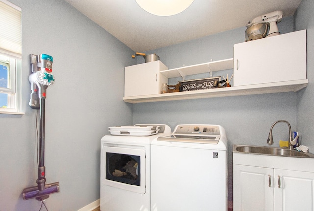 426 Meadowind Ct, Pinckney, MI 48169 - laundry area with cabinet space and separate washer and dryer
