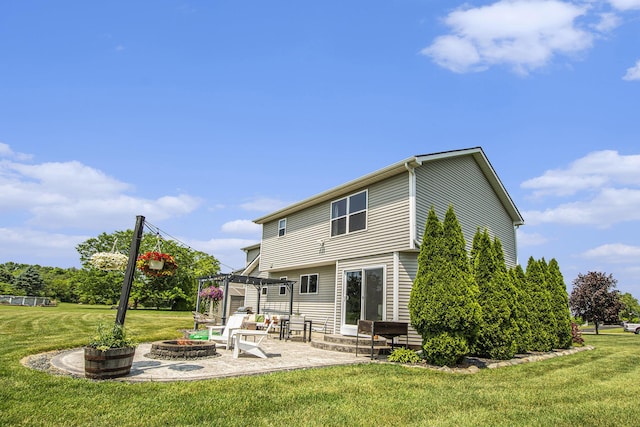 426 Meadowind Ct, Pinckney, MI 48169 - rear view of house featuring a fire pit, a pergola, a patio, and a lawn