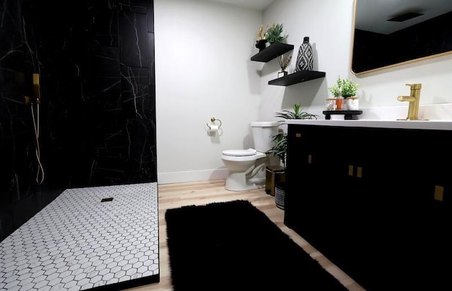 103 Cottonwood Ct, Litchfield, MI 49252 - full bathroom featuring vanity, a marble finish shower, and wood finished floors