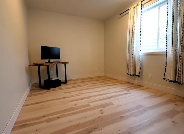 103 Cottonwood Ct, Litchfield, MI 49252 - empty room with wood finished floors and baseboards