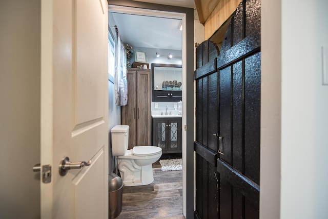 3360 Broad St, Dexter, MI 48130 - half bath featuring wood finished floors and vanity