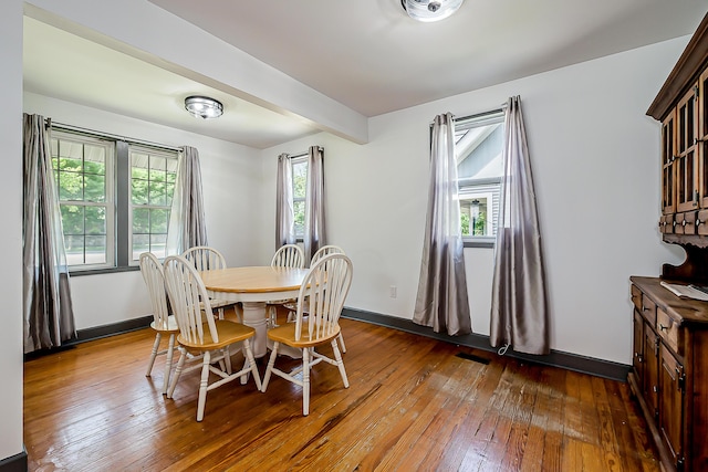 3360 Broad St, Dexter, MI 48130 - dining area featuring hardwood / wood-style flooring and beamed ceiling