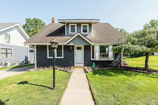 3360 Broad St, Dexter, MI 48130 - bungalow-style house featuring a front lawn, a shingled roof, a porch, and a chimney