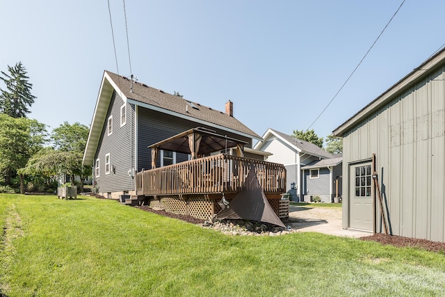3360 Broad St, Dexter, MI 48130 - rear view of house featuring a deck and a lawn
