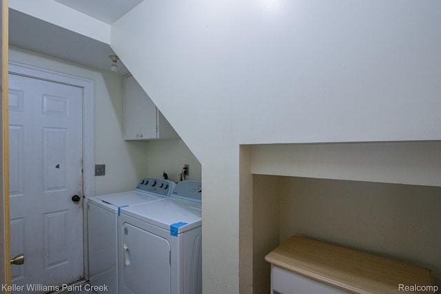 235 E Saint Clair St, Almont, MI 48003 - washroom featuring washer and clothes dryer and cabinet space