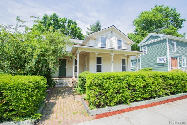 235 E Saint Clair St, Almont, MI 48003 - view of front of property with covered porch