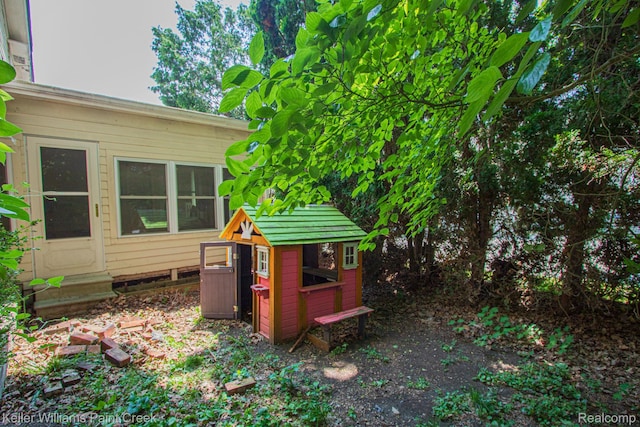 235 E Saint Clair St, Almont, MI 48003 - view of yard with exterior structure and an outdoor structure