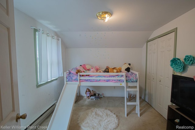 235 E Saint Clair St, Almont, MI 48003 - carpeted bedroom featuring lofted ceiling, baseboard heating, and a closet