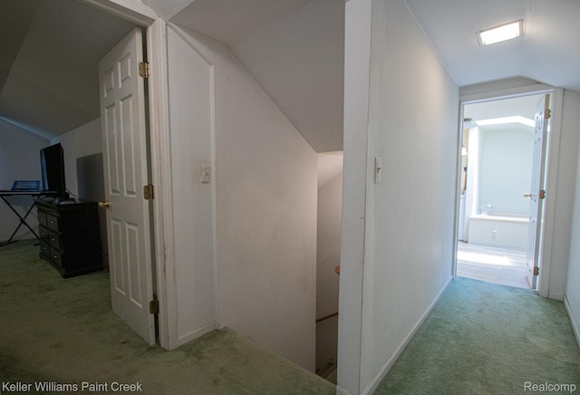 235 E Saint Clair St, Almont, MI 48003 - hall featuring carpet floors, vaulted ceiling, and an upstairs landing