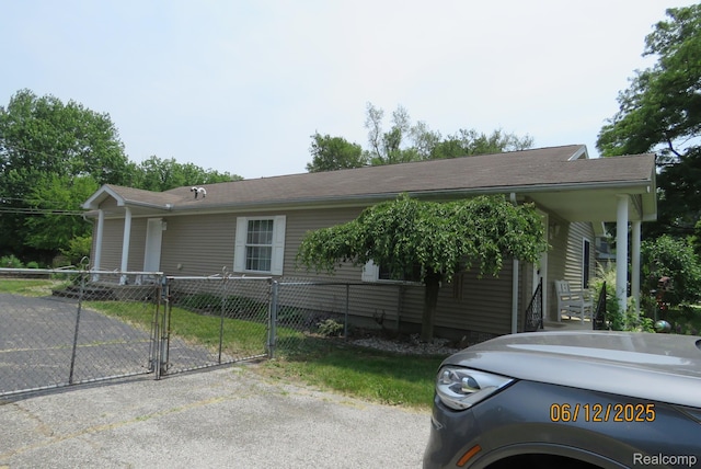 10571 Baraga St, Taylor, MI 48180 - view of front facade with a gate