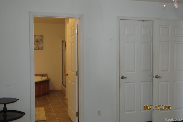 10571 Baraga St, Taylor, MI 48180 - hall with dark tile patterned flooring