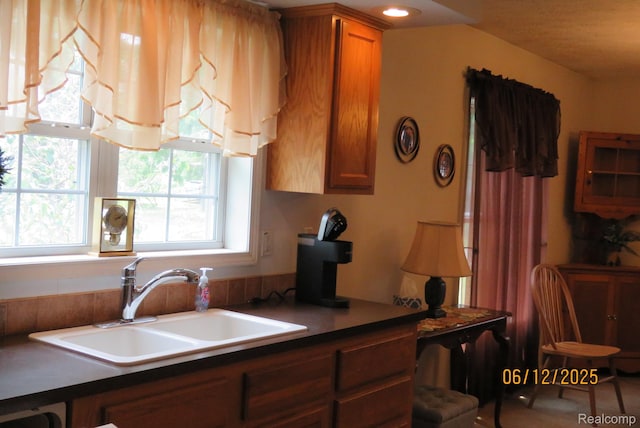 10571 Baraga St, Taylor, MI 48180 - kitchen with brown cabinets and dark countertops