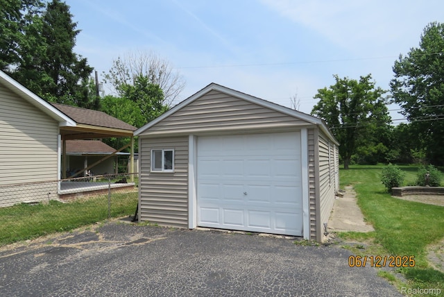 10571 Baraga St, Taylor, MI 48180 - detached garage featuring asphalt driveway