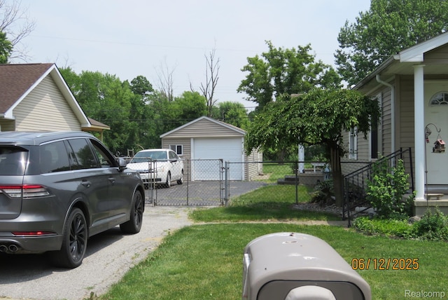 10571 Baraga St, Taylor, MI 48180 - view of yard with a garage, a gate, and an outdoor structure