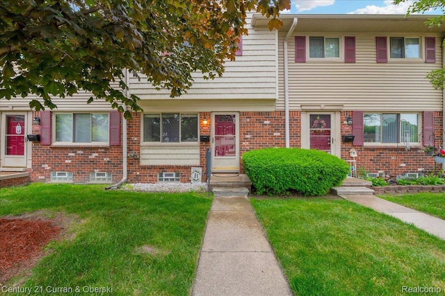 23505 Baker St, Taylor, MI 48180 - multi unit property featuring a front lawn and brick siding