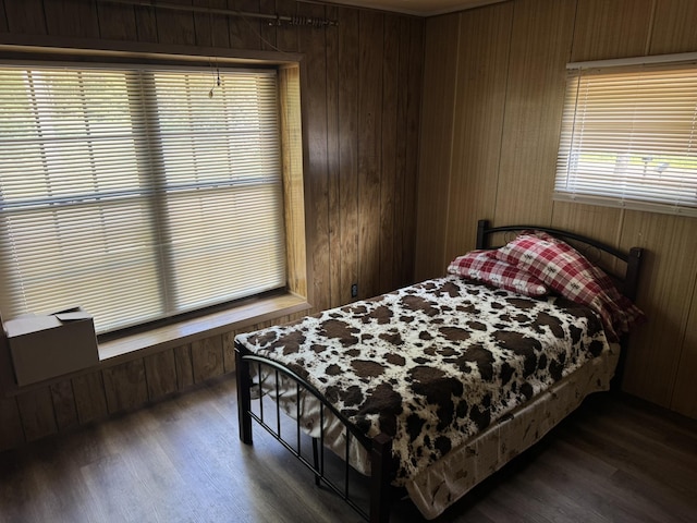 1321 Ziggy Rd, Farwell, MI 48622 - bedroom with dark wood-type flooring and wooden walls