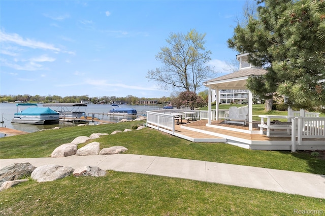3565 Port Cove Dr Unit 68, Waterford, MI 48328 - dock area featuring a gazebo, a water view, and a lawn