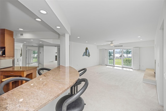 3565 Port Cove Dr Unit 68, Waterford, MI 48328 - kitchen with recessed lighting, ceiling fan, open floor plan, light colored carpet, and healthy amount of natural light
